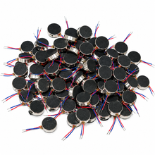 Load image into Gallery viewer, A pile of small round black electronic components with silver metal rims and multicolored wire leads, photographed on a plain white background.
